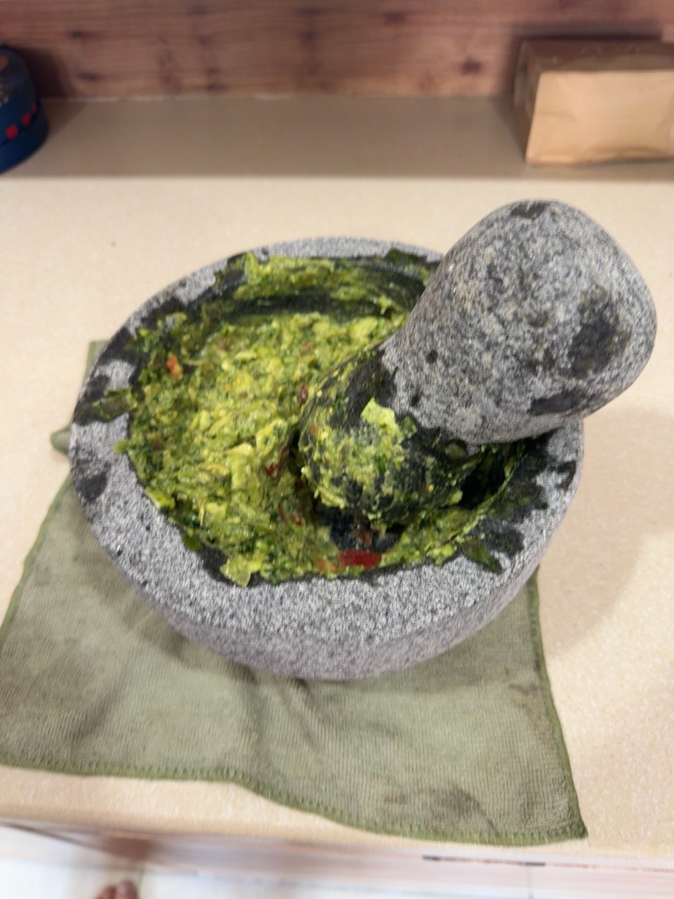 Guacamole after mashing in avocado and tomato.