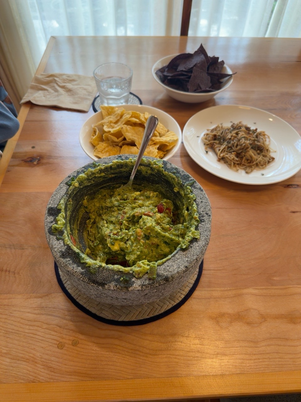 Guacamole served on the lunch table.